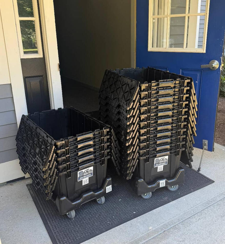 Untitled 44 reusable moving crates stacked at a front door in West Warwick, RI